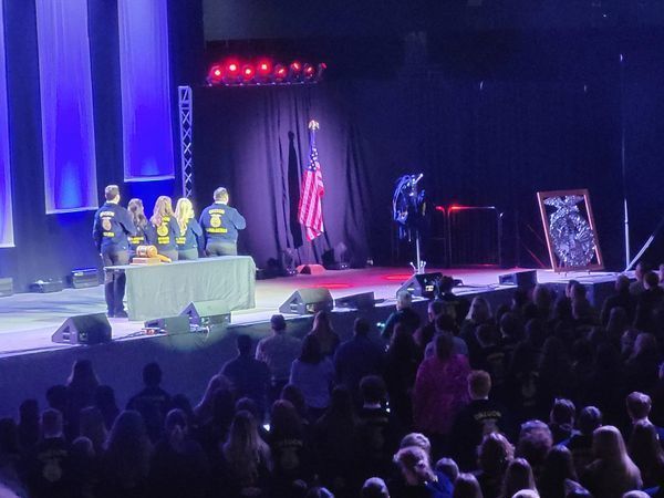 student ffa state officers on stage during pledge of allegiance